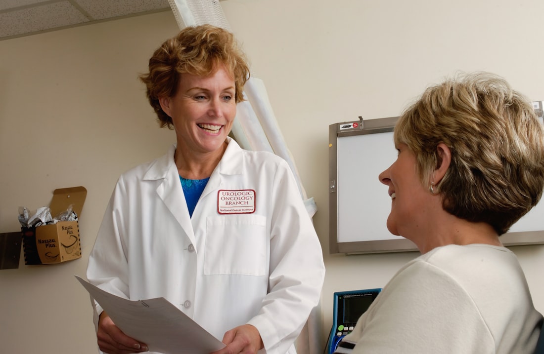 Doctor consulting warmly with a patient about liver health and screening
