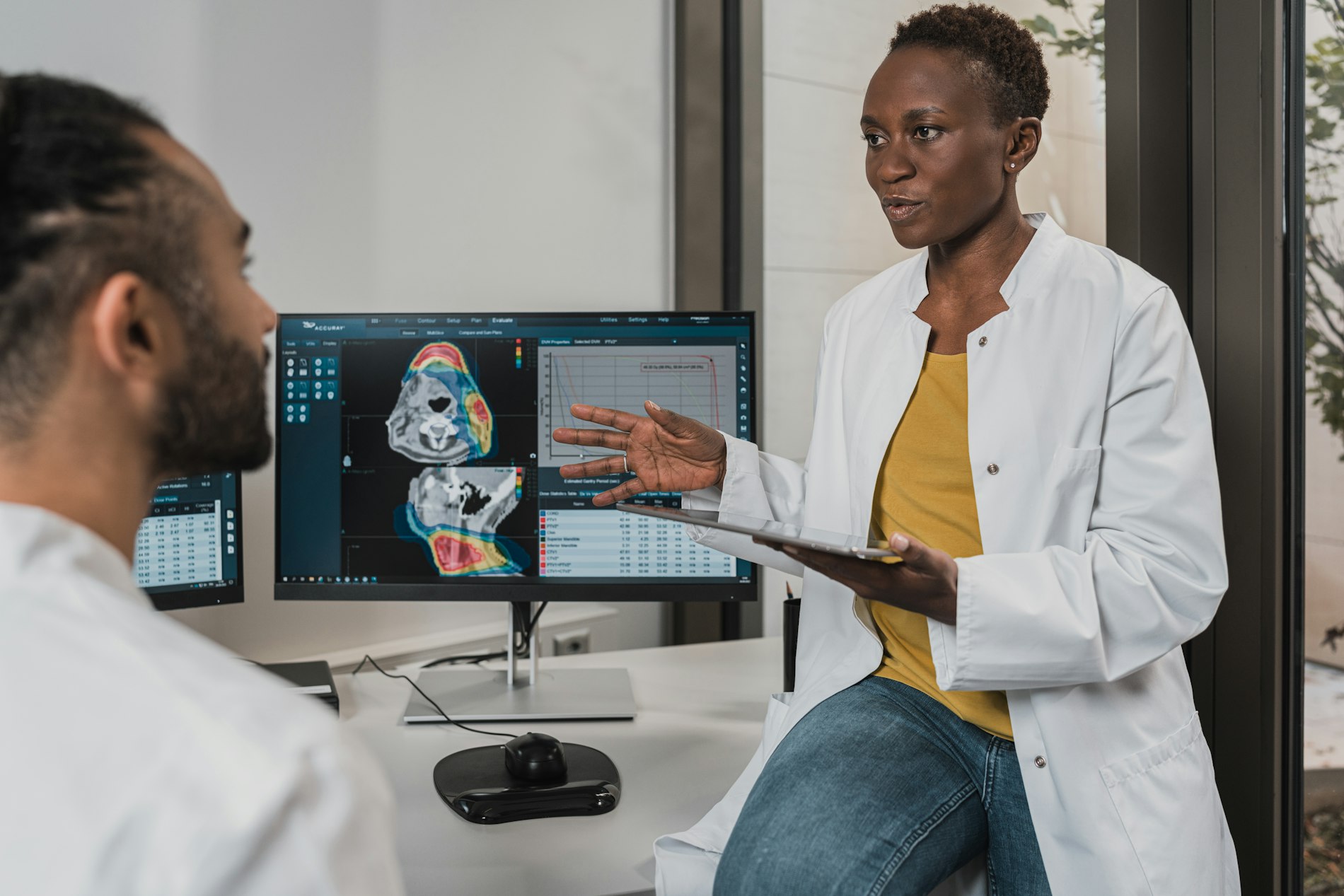 Physician reviewing diagnostic results with a patient in a clinical setting